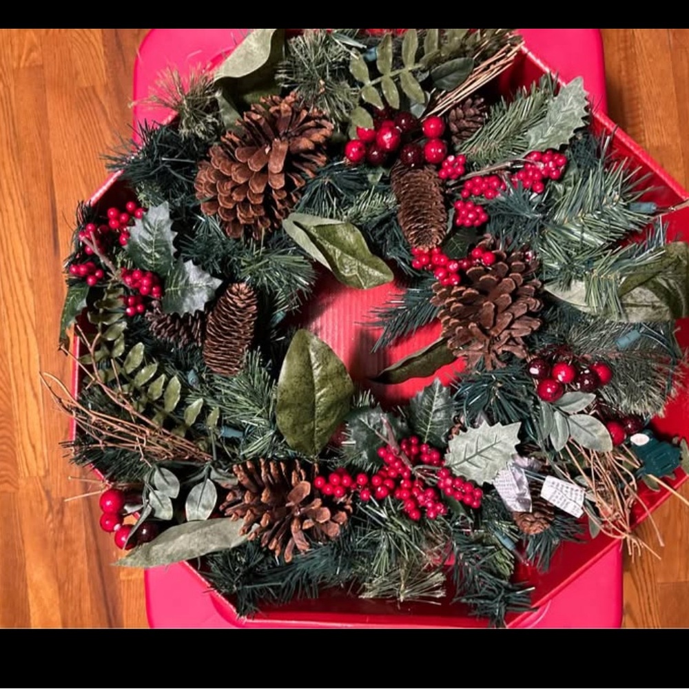 Christmas Holiday Wreath with Pinecones, red berries, white lights.
